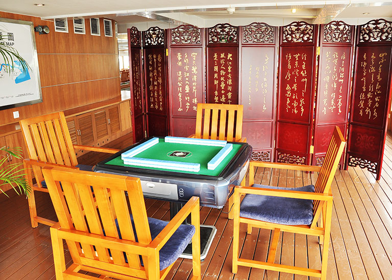 Playing Mahjong with your friends on New Century Cruises